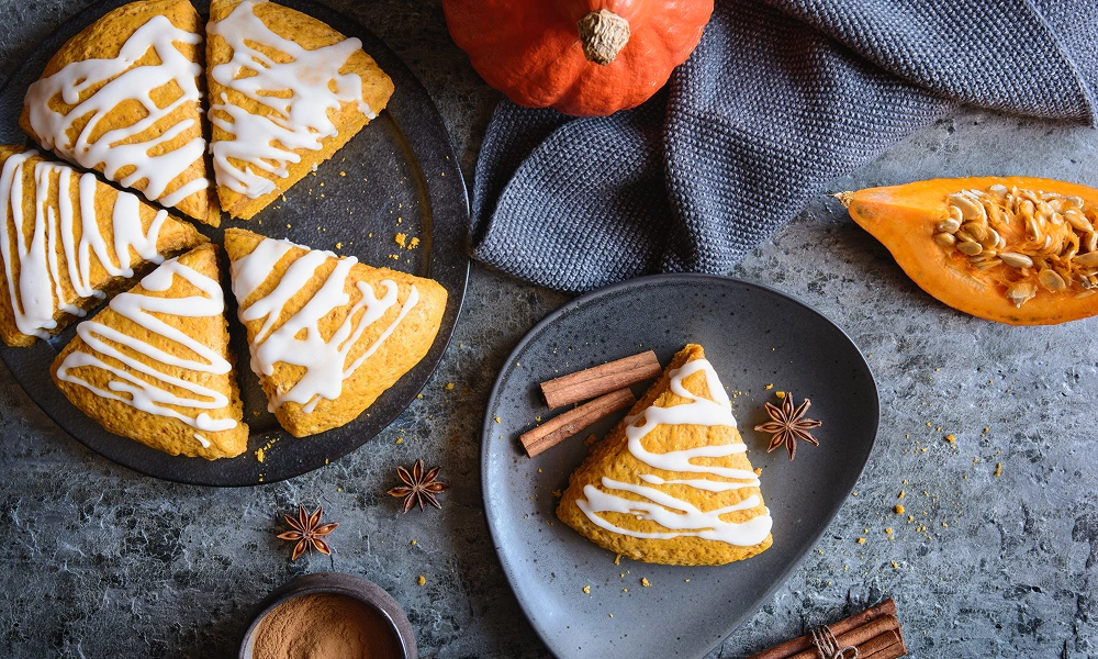 Autumn-themed dessert display with pumpkin